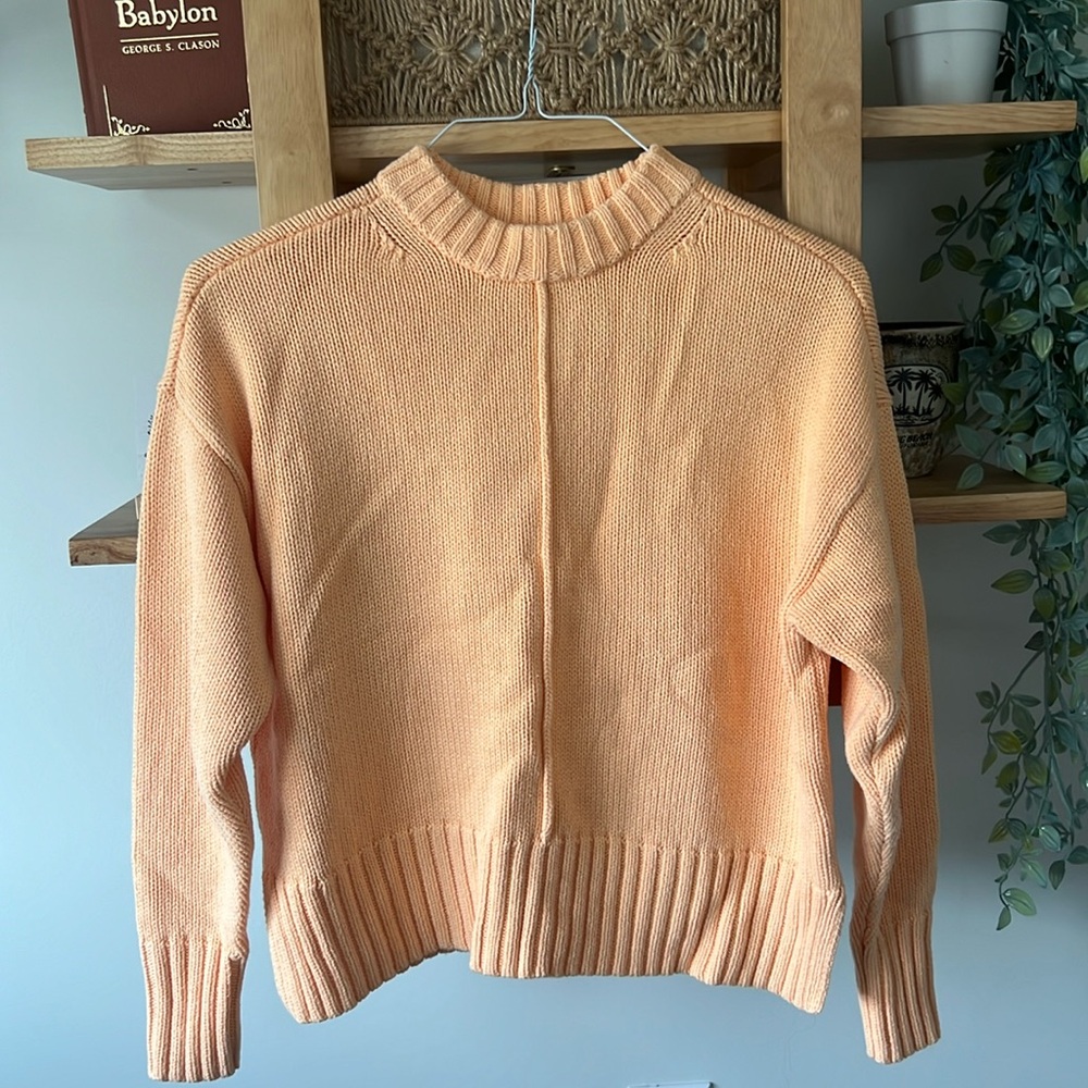 A New Day sweater in a bright clementine color in size small, fits true to size